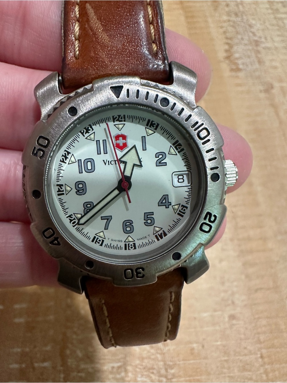 Victorinox Silver Bezel Watch with White Dial and Brown Leather Strap